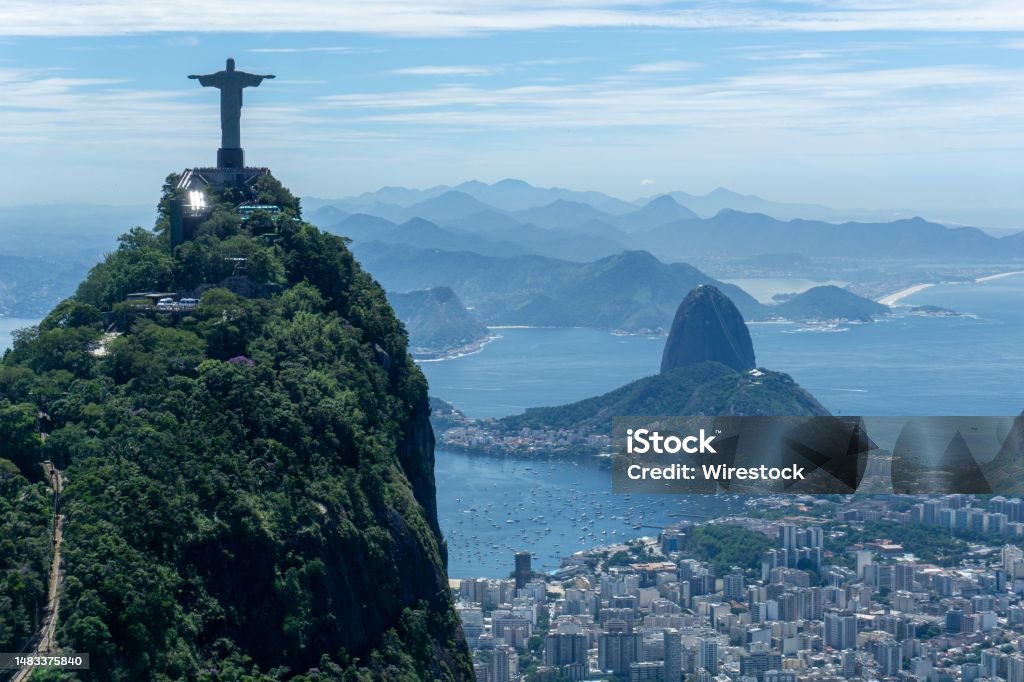 Iconic Rio de Janeiro skyline, with the world-famous Christ the Redeemer statue in the foreground the iconic Rio de Janeiro skyline, with the world-famous Christ the Redeemer statue in the foreground Bay of Water Stock Photo