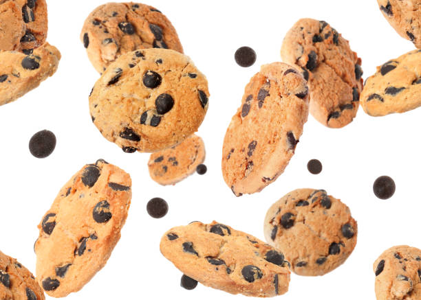 istock Delicious chocolate chip cookies falling on white background 1483375879