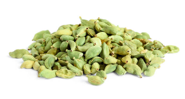 istock Pile of dry cardamom seeds on white background 1483376538