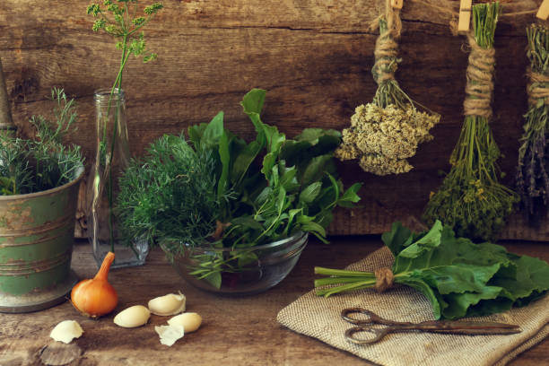 istock Different herbs, rusty scissors and burlap fabric on wooden table 1483377153