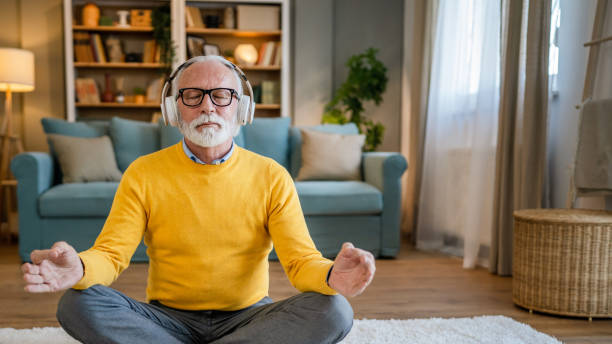 istock Mature senior man practice guided meditation manifestation at home 1483379874