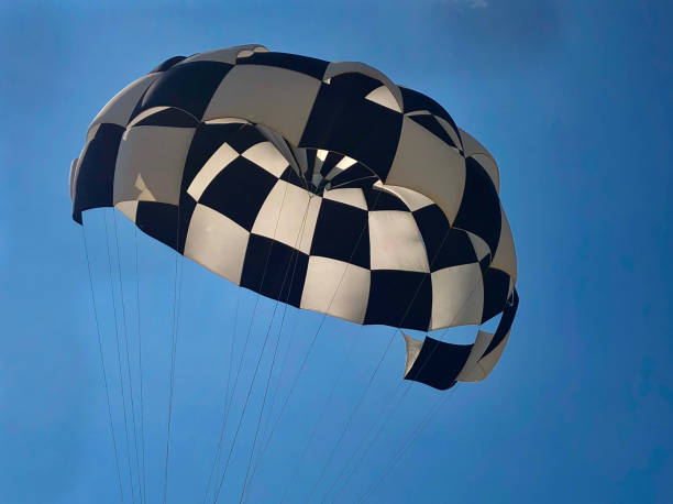 Low Angle View Of Parachute Against Blue Sky