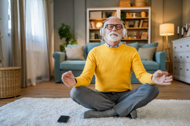 istock Mature senior man practice guided meditation manifestation at home 1483380224