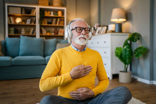 istock Mature senior man practice guided meditation manifestation at home 1483381429