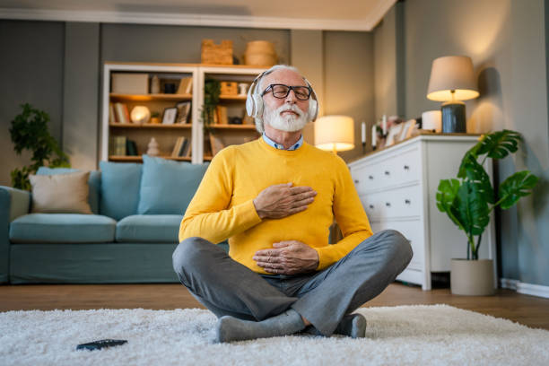 istock Mature senior man practice guided meditation manifestation at home 1483381659