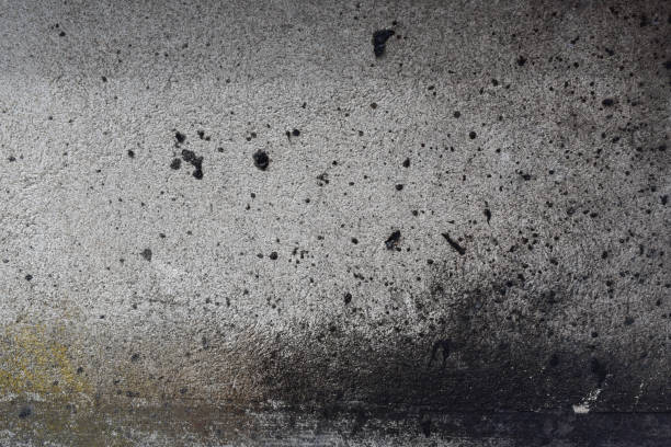 istock texture of a wall full of black spray paint. 1483384511