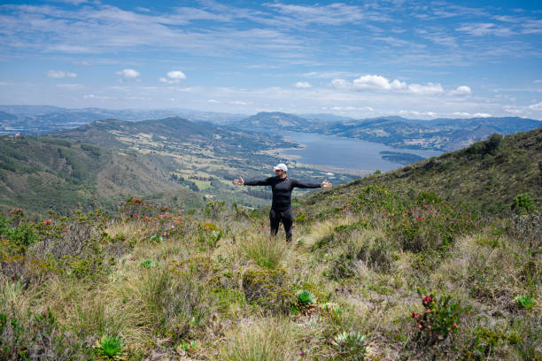 group of friends walking on the mountain, enjoying the landscape with their pets.