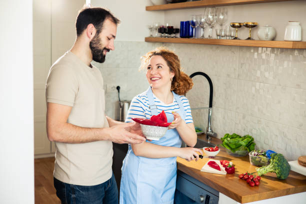 istock Couple is preparing a meal together 1483388290
