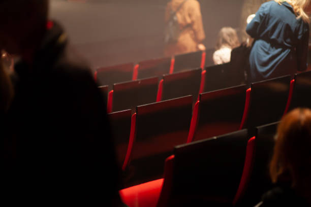istock audience arriving and taking seats at theater 1483388483