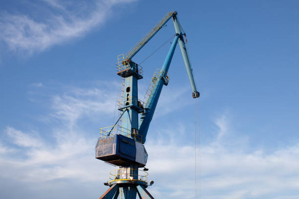 istock huge harbor crane operating outdoors 1483388485