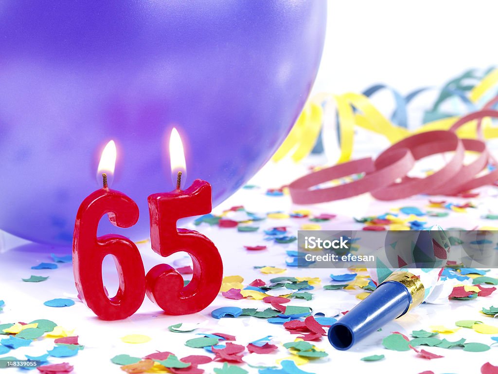 Birthday-anniversary Nr. 65. Birthday-anniversary party with Nr. 65 made with red candles. 65-69 Years Stock Photo