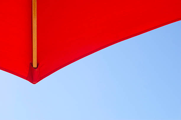 istock Red Umbrella Against Blue Sky From Below 148339060