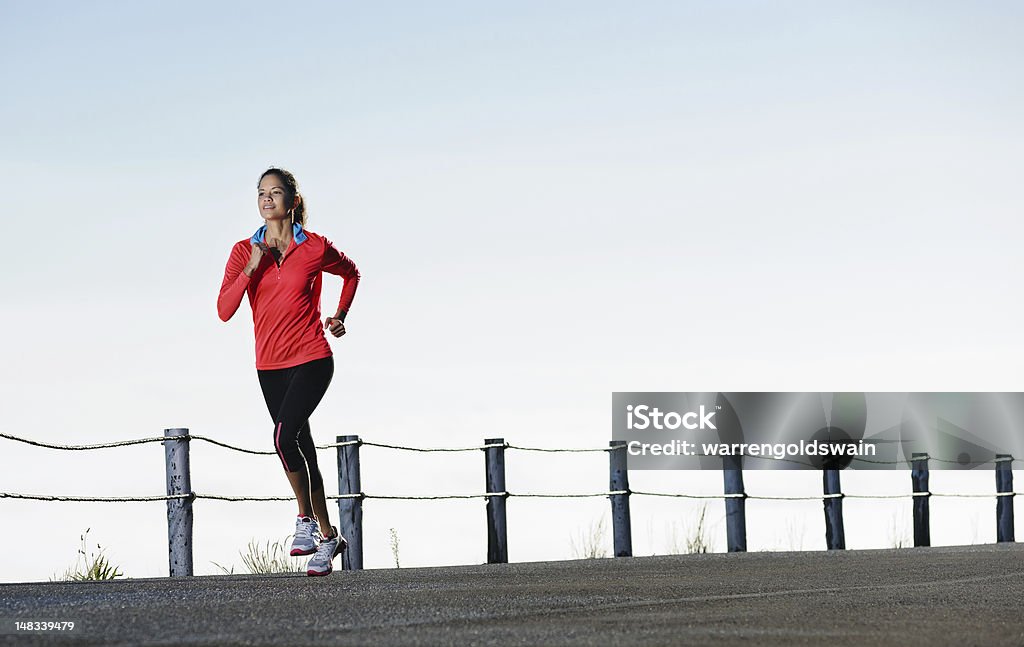 Running panorama fitness Athletic runner training alone on a road outdoors for marathon and fitness. healthy wellness exercise panorama with copyspace. Active Lifestyle Stock Photo