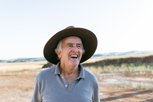 Senior farmer laughing