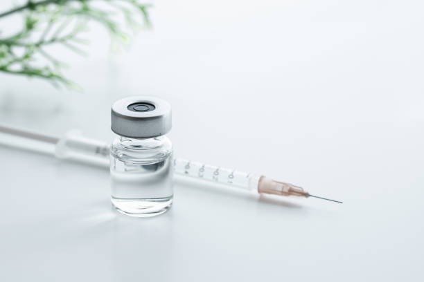 vaccine and syringe. Image of vaccination. vaccine, syringe, vial, white background, bright image injecting stock pictures, royalty-free photos & images