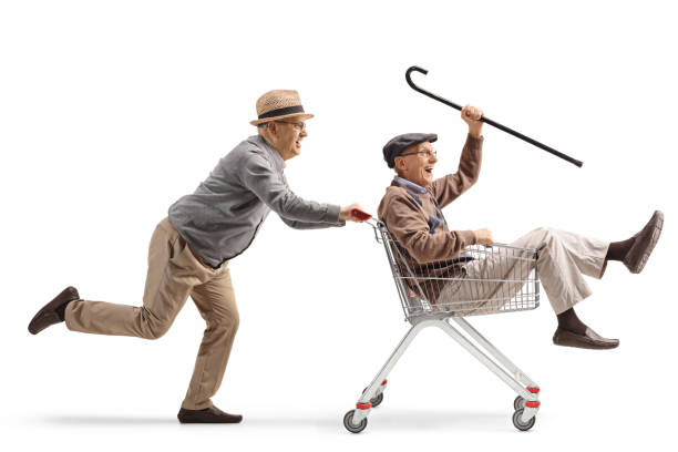 istock Senior men having fun and riding inside a shopping cart 1483409289