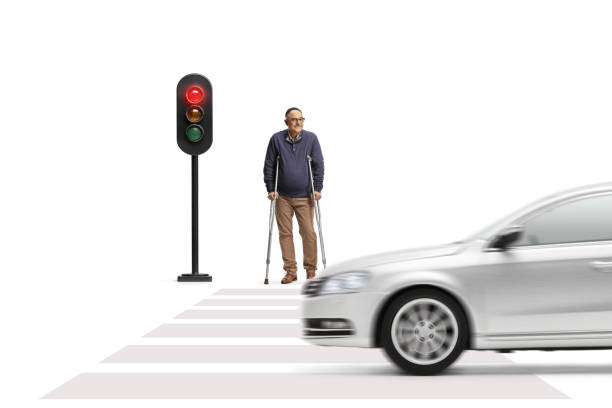 istock Mature man with crutches waiting at traffic lights 1483409310