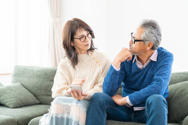 senior age couple using a smart phone, trouble stock photo