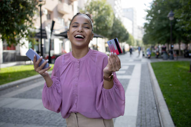istock Cheerful  woman doing online shopping 1483410998