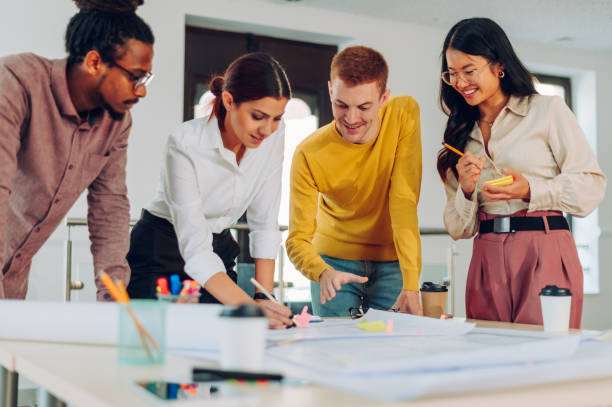istock Diverse group of engineers or architects having a meeting in an office 1483412915