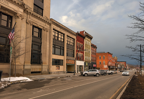 Olean, NY, USA - January 28, 2023: The facades along North Union St of this western New York town present varying degrees of economic stress and revitalization on bleak winter late afternoon.