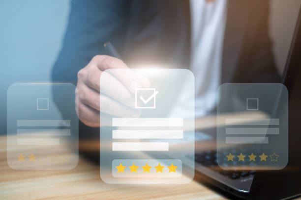 istock Man using laptop and touch virtual screen and give five star symbol to increase rating of product and service concept, Customer satisfaction, selective focus. 1483415728