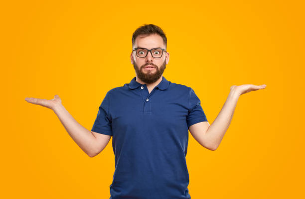 Surprised man showing empty hands stock photo