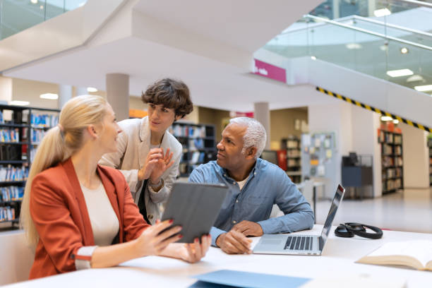 istock Readers and students in the library 1483417120