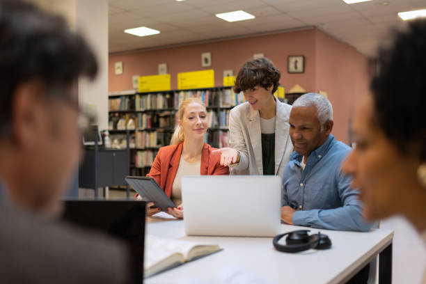 istock Readers and students in the library 1483417124
