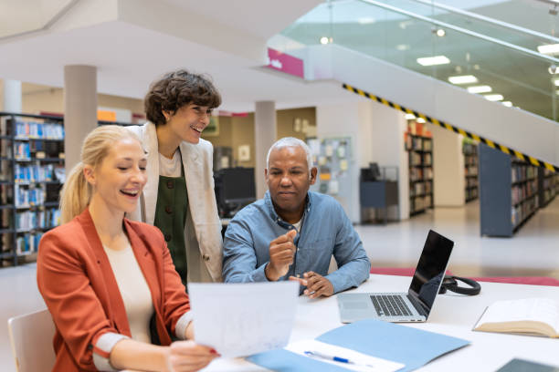 istock Readers and students in the library 1483417125