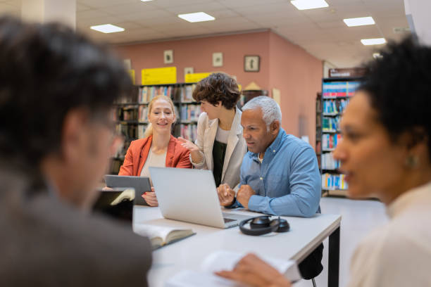 istock Readers and students in the library 1483417129
