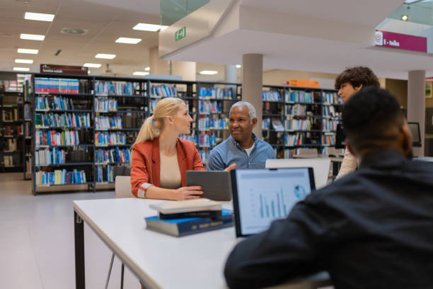 istock Readers and students in the library 1483417133