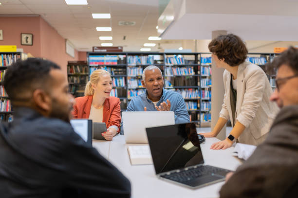istock Readers and students in the library 1483417135