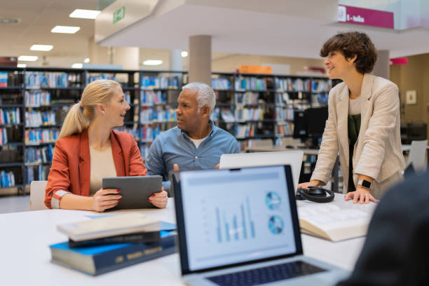 istock Readers and students in the library 1483417140