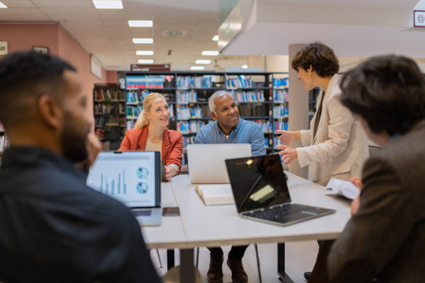 istock Readers and students in the library 1483417142
