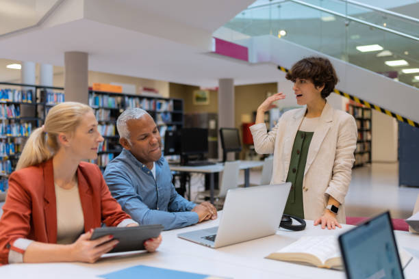 istock Readers and students in the library 1483417147