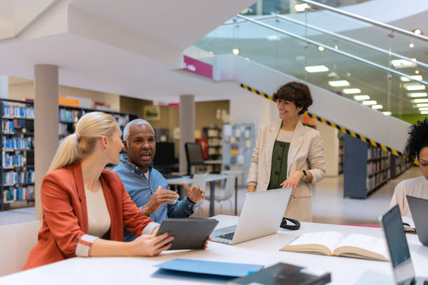 istock Readers and students in the library 1483417159