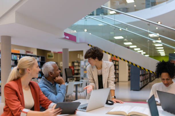 istock Readers and students in the library 1483417160