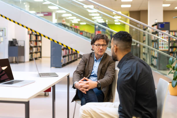 istock Readers and students in the library 1483417167