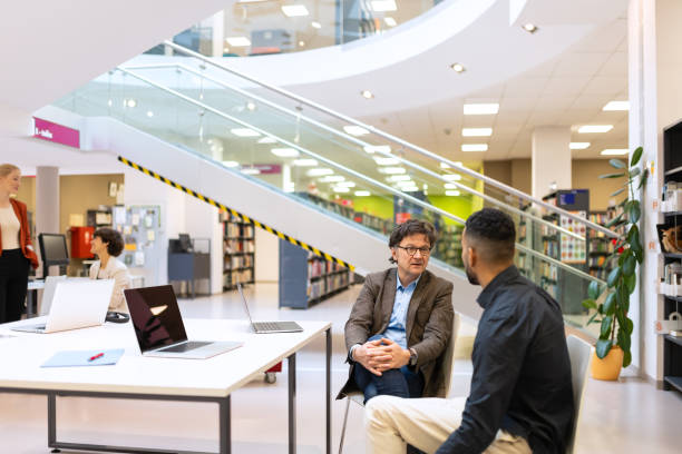 istock Readers and students in the library 1483417173