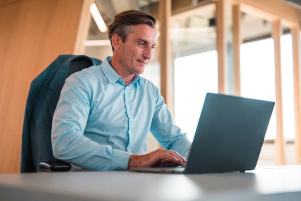 istock Handsome Male Lawyer Working In A Modern Office With A Laptop 1483417703