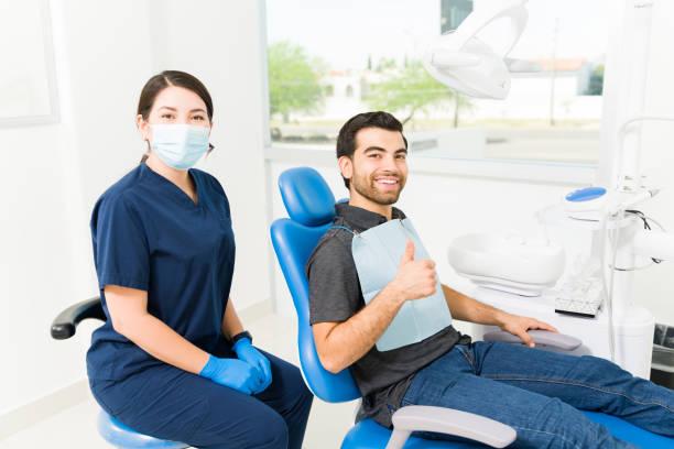 istock Cheerful man patient feeling happy at the dentist 1483421774