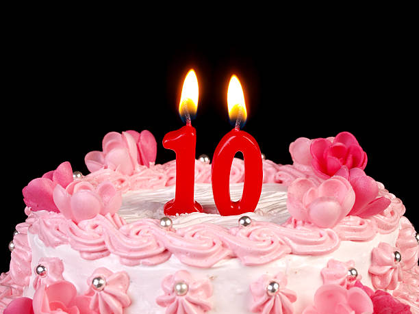 Birthday-anniversary cake Nr. 10 Birthday-anniversary cake with red candle showing Nr. 10 10 11 years photos stock pictures, royalty-free photos & images