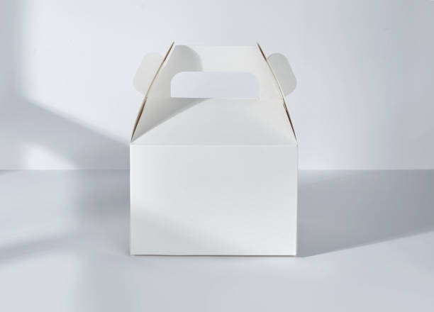 istock Take away cake box with window shadow isolated on white background 1483425529