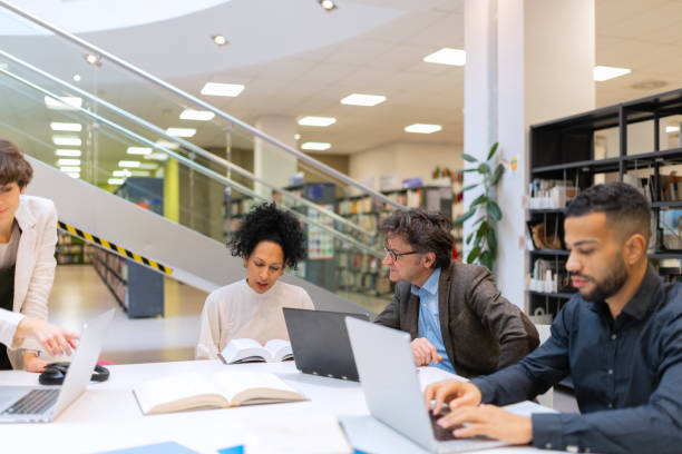 istock Readers and students in the library 1483428402