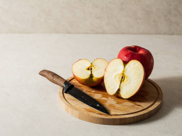 istock red apples on a wooden chopping board 1483430412