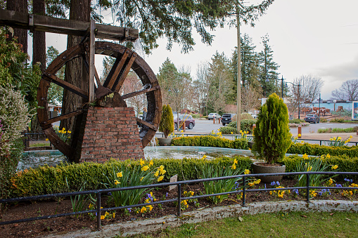 Chemainus, Canada - April 19, 2023. Waterwheel Park in downtown Chemainus is  the centre of activity during tourist season, with weekly markets and ample parking for the nearby amphitheatre, museum, and murals.