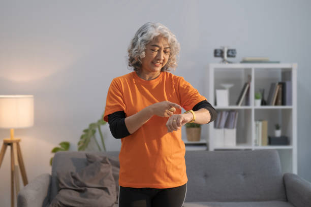 istock Positive mature lady doing her workout routine and checking fitness statistics on smart watch. 1483435480