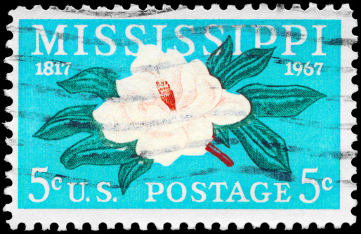 A Stamp printed in USA shows the Magnolia, Mississippi Statehood, 150th anniversary, circa 1967