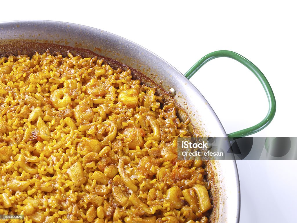 Rice the Band Traditional Valencian Dish.  The Paella is the most worldwide well-known Valencian dish, but the gastronomy in this Spanish Region has a large variety of rice dishes. The “Arroz A Banda” is a kind of seafood paella cooked  with seafood  stock. Paella Stock Photo